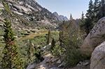 A faint trail leads towards Upper Boy Scout Lake. It soon disappears. Lower Boy Scout Lake is in the background.