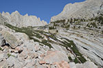 Looking up towards Upper Boy Scout Lake. The correct path stays close to the brush until you can cross over to the granite slabs on the other side of the creek.